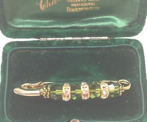 Biżuteria vintage bajeczna zielona kryształ stras broszka szpilka