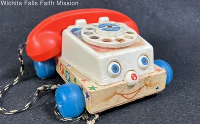 Juguete para tirar telefónico Fisher Price con ojos móviles Foto 1 de 4