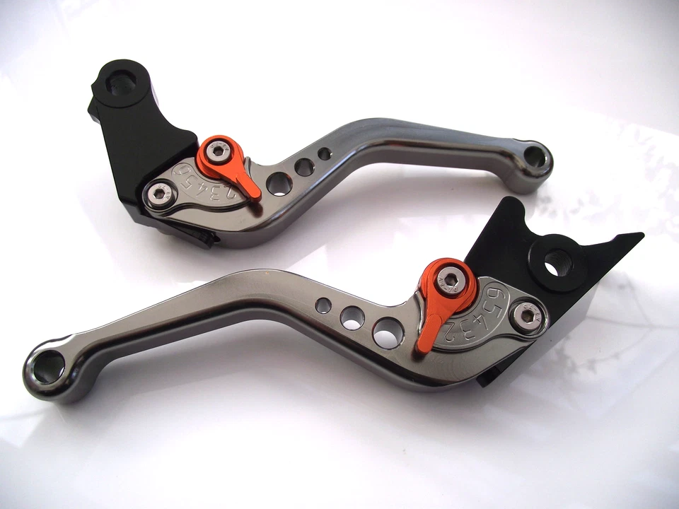 Juego de palancas CNC KTM (640, 625, 660) ajustadores cortos titanio y naranja DB12/C31 Foto 1 de 1