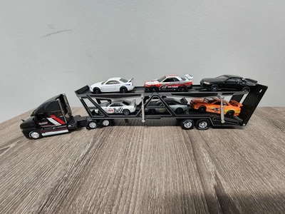 Portavehículos con 6 Sueltos Nissan Skyline R34 Fast & Furious Gran Turismo Foto 1 de 4