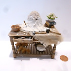 FABULOUS DOLLHOUSE MINIATURE TABLE WITH A FLOWER ARRANGEMENT BEING SCULPTED