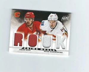 2012-13 Panini Prime Dual Jerseys #1 Akim Aliu Sven Baertschi /200  FLAMES - Picture 1 of 1