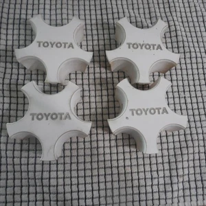1986-1990 TOYOTA SUPRA OEM CENTER CAP SET (4) A70 MK3 WHITE RARE - Picture 1 of 11