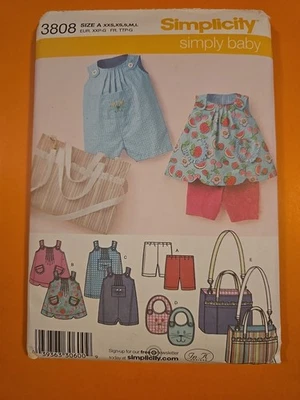 SIMPLICITY PATTERN 3808 BABIES' TOP, ROMPER, BIB, DIAPER BAG & KNIT SHORTS - Image 1 of 3