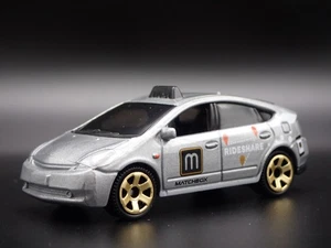 2003-2008 TOYOTA Prius Rideshare Taxi 1/64 Scala da Collezione Modellino Auto - Foto 1 di 7