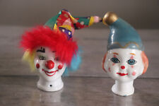 Deux tetes de clown en porcelaine
