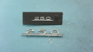 MERCEDES-BENZ  W123  250  ,  TRUNK  EMBLEM AND  DASH EMBLEM  , USED ,1238170615 - Picture 1 of 6