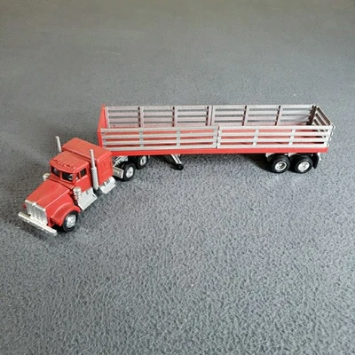 Semirremolque Lionel rojo fundido a presión plataforma remolque de estacas 027 Union Pacific Express Foto 1 de 4