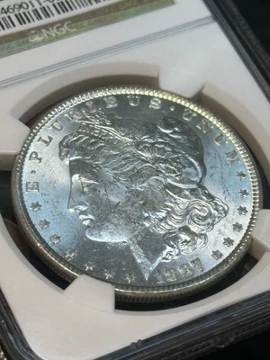 1887 Morgan Silver Dollar Mint Error MS63 Obverse Struck Through NGC Certified - Image 1 of 3