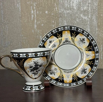 Grace’s Teaware Black & Gold Cup & Saucer Set – Elegant Floral Scroll Design - Image 1 of 4