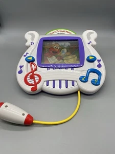 Sistema de aprendizaje interactivo Mattel Learn Through Music 2002 con Elmo - NECESITA TLC - Imagen 1 de 15