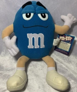 Nanco ~ 2001 Personaje de peluche azul 9” M&M ~ Con etiqueta de licencia y etiquetas Tush - Imagen 1 de 12
