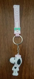Snoopy's Schwester Belle 3D Schlüsselanhänger mit Strive Handschlaufe SPASS - Bild 1 von 7