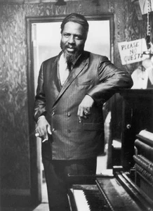 jazz musician Thelonious Monk holding a cigarette standing next - 1966 Old Photo - Picture 1 of 1