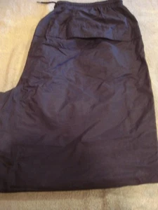 VINTAGE PAIR OF UNIVERSITY OF NOTRE DAME 100% NYLON SWEAT PANTS (SIZE - LARGE) - Picture 1 of 6