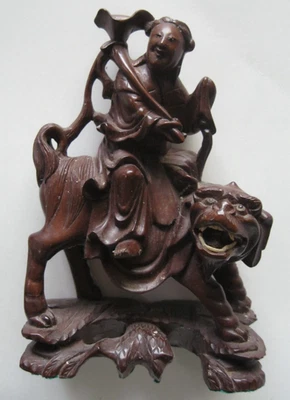 Vintage CHINESE IMMORTAL HE XIAN GU Riding Foo Dog Wood Carved Figure - Image 1 of 4