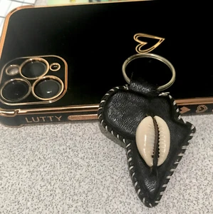 Llavero de cuero vintage concha marina mapa de África/tribu Tuareg/hecho a mano en Malí - Imagen 1 de 4