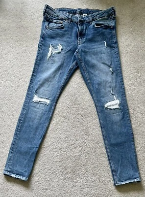 Pantalones de mezclilla ajustados ligeros con cremallera azul claro Foto 1 de 4