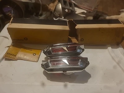 NOS VINTAGE ORIGINAL GM OLDSMOBILE CUTLASS 442 REAR MARKER LIGHT 68 69 W/HOUSING - Image 1 of 4