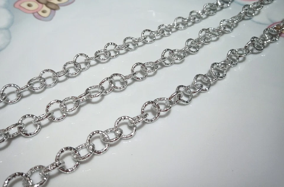 1mt  catena tondo Alluminio puntinata 12mmx2mm colore argento bijoux - Immagine 1 di 1