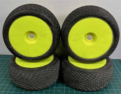JConcepts 1/8 Buggy Tires on Yellow Dish Wheels 17mm Hex Set of 4 Blue Compound - Image 1 of 4