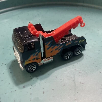 1997 Hot Wheels  Tow Truck Black w Flames  - Image 1 of 4