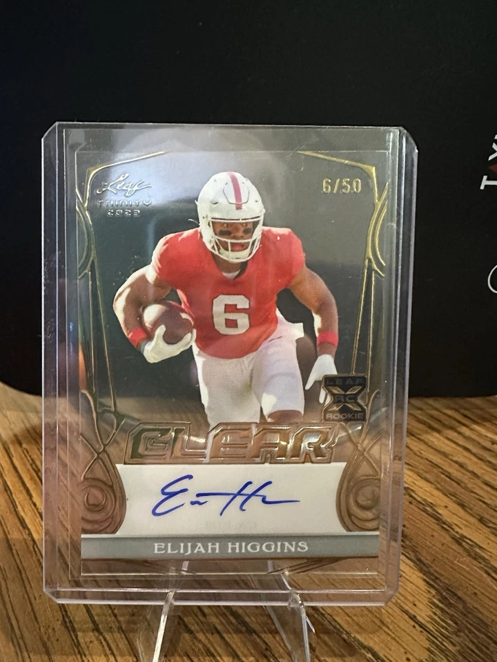 2023 Leaf Trinity ELIJAH HIGGINS RC Rookie Auto Autograph /50 - Clear Gold - Image 1 of 2