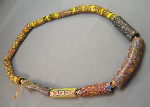 Cuentas comerciales africanas venecianas vintage 24" de largo mezcladas Millfiori tubos largos 1 curva - Imagen 1 de 7