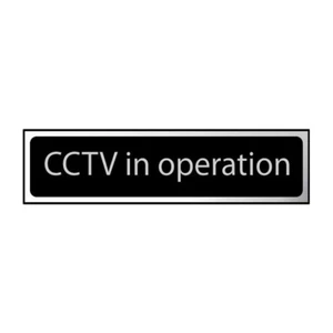 CCTV in Operation Sign Self-Adhesive PVC - Black and Chrome Effect 200mm x 50mm - Picture 1 of 2