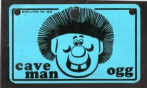 1973 Kelloggs Müsli Fahrrad Nummernschild -- Cocoa Krispies -- Caveman Ogg - Bild 1 von 1