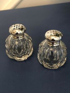 Silver topped pretty cut glass salt and pepper pots.