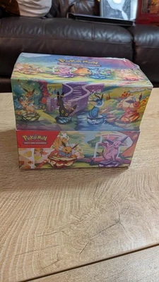 Prismatic Evolutions SEALED Mini Tin Display Box Full Set of 8 Tins - SPANISH - Image 1 of 4