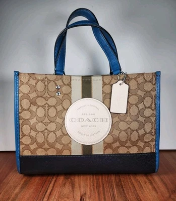 Bolso de Mano COACH Dempsey Marrón Firma Jacquard y Borde de Cuero Azul Excelente Estado Foto 1 de 4