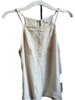 Camiseta sin mangas pequeña con sombra de ojos para mujer marfil bordada correa de espagueti pulóver. Foto 1 de 4