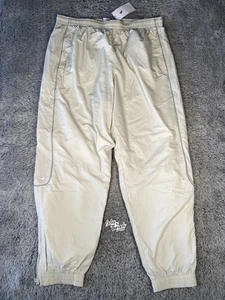 Nike Solo Swoosh Track Pants Size XL Men Light Bone White FB8620-072 - Picture 1 of 9