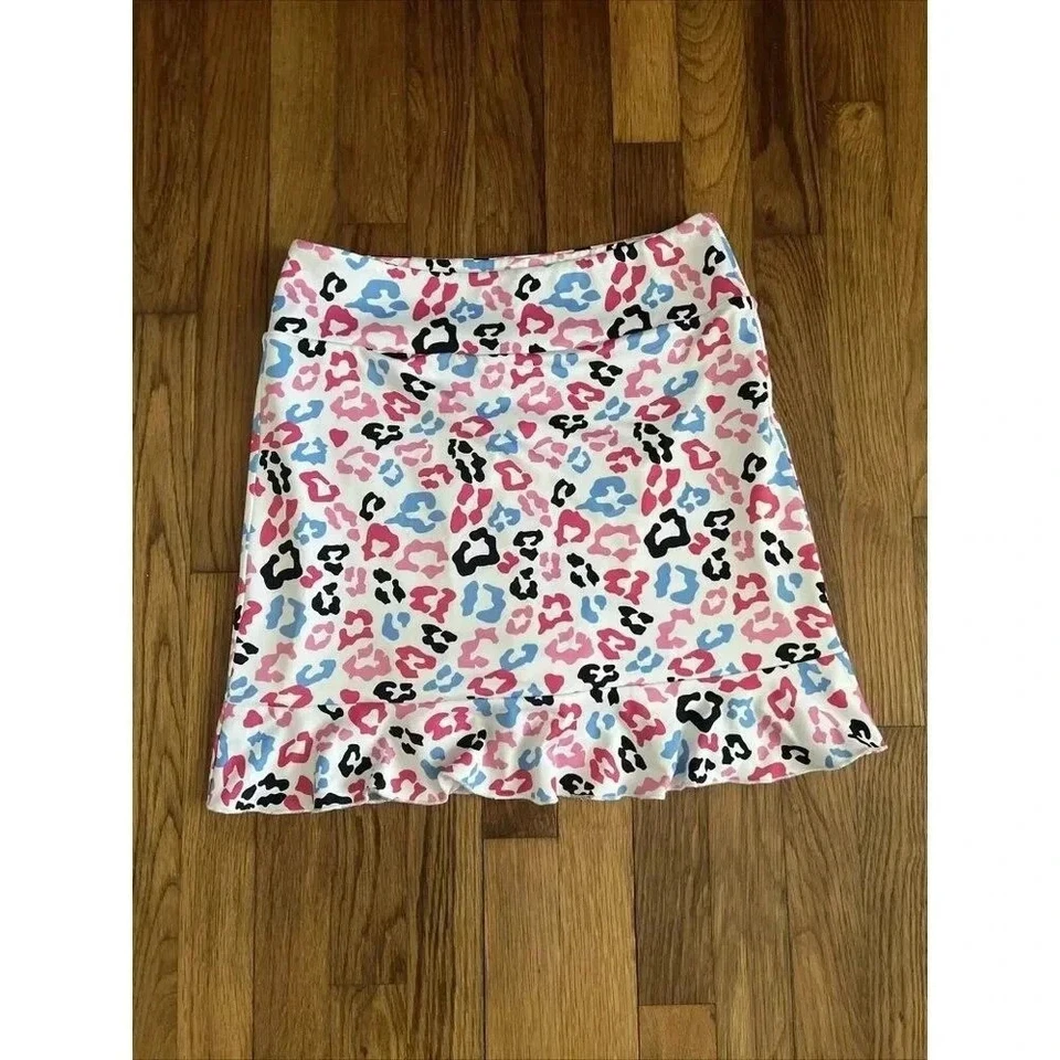 Falda corta de golf GOLFTINI Big Bang para mujer Pull On Tech blanca rosa azul falda con volantes S Foto 1 de 4