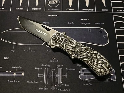 Cuchillo táctico Schrade Boneyard Lazy Bones SCHA16B Skulls asistencia de resorte AUS8 Foto 1 de 2