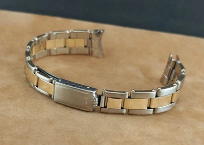 Pulseira feminina Rolex aço ostra/ouro maciço rebitada 7204, com extremidades de 13 mm. Ca 1964 - Imagem 1 de 4