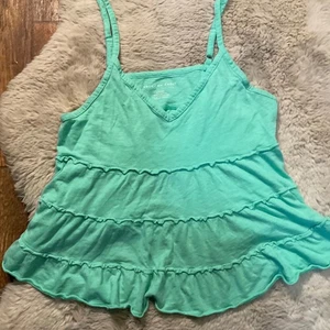 Muñeca bebé American Eagle talla pequeña verde en capas para mujer como nueva - Imagen 1 de 8