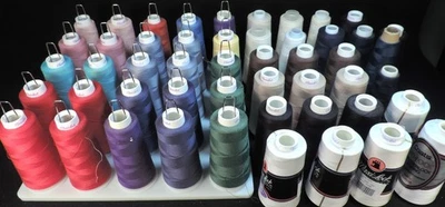 lot of 50 SPOOLS MIXED LOT SERGER THREAD + HOLDER - Image 1 of 4