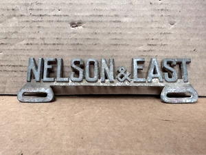 Vintage Nelson and East License Plate Topper Auto Accessories Collectible! - Picture 1 of 6