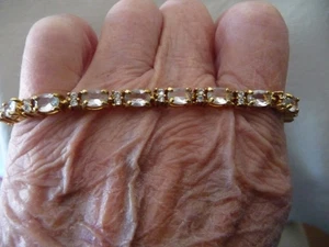 BRAZALETE TENIS AVON PIEDRAS TRANSPARENTES CON DIAMANTES DE IMITACIÓN 6,5/7,5' TONO DORADO #12/10-H - Imagen 1 de 7