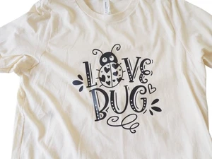 Camiseta Bella Canvas Niños Beige con Gráfico Love Bug Talla XL (18/20) - Imagen 1 de 8