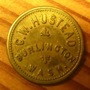 #12 – Old Brass Trade Token – C.W. HUSTEAD - BURLINGTON, WASH. - Picture 1 of 4