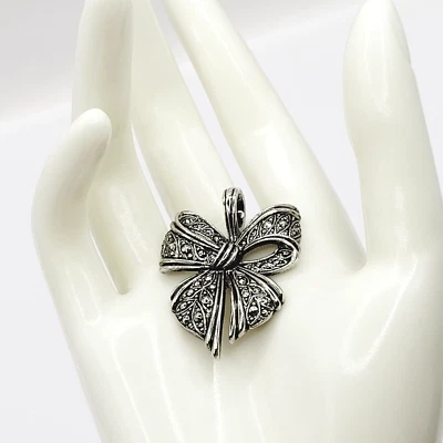 Ribbon Bow Ornate Pattern Faux Marcasite Feminine Open Metal Silver Tone Pendant - Image 1 of 4