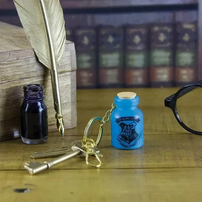 Harry Potter Key Chain Hogwarts Blue Potion Bottle Light Up Metal Keyring Crest - Image 1 of 2