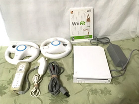 Wii nintendo console & accessories, remote, wheels, nunchuck, power cord,, works