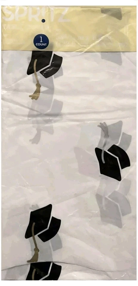 White Plastic Table Cloth 52 X 108" W/ Black Graduation Caps(EY489-94) - Image 1 of 1