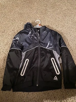 Jaqueta corta-vento Reebok Guard. Meninos preto e cinza tamanho XXL - Imagem 1 de 2