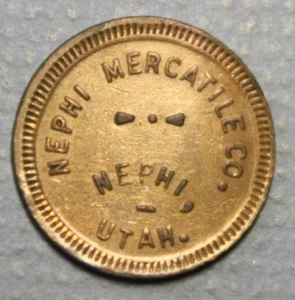 Ficha redonda Nephi Utah Nephi Mercatile buena para mercancía 5c latón 21 mm - Imagen 1 de 2